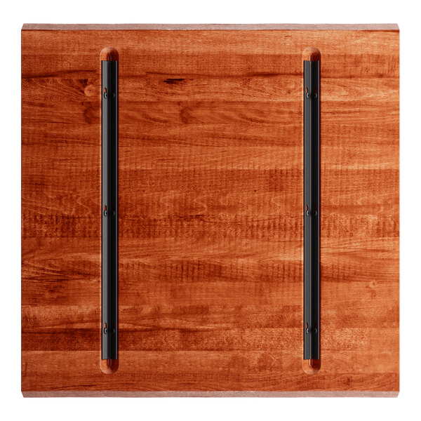 A Lancaster Table & Seating solid wood live edge table top with a rustic mahogany finish.