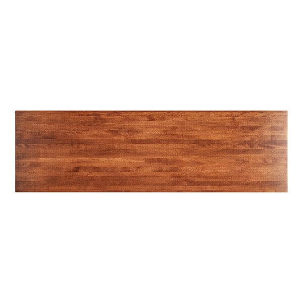 A Lancaster Table & Seating wooden rectangular table top with a rustic mahogany finish.