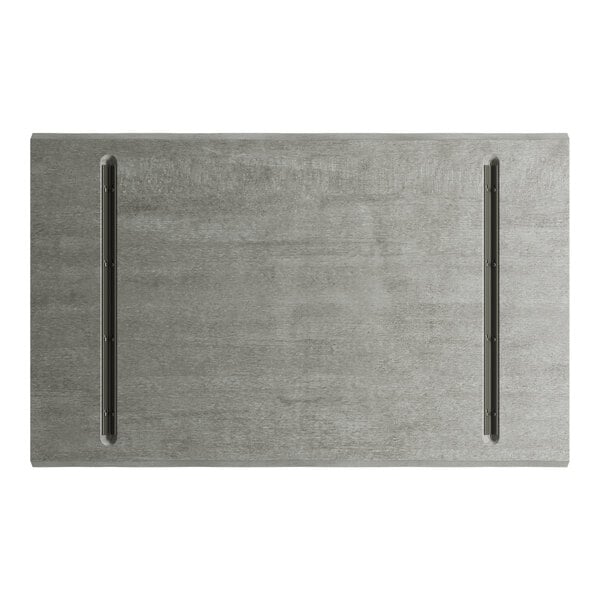 A Lancaster Table & Seating live edge table top with a slate grey surface.