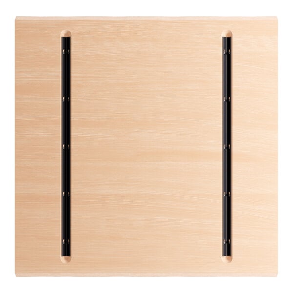 A Lancaster Table & Seating solid wood live edge table top with a bleached oak finish.