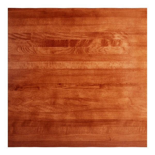 A Lancaster Table & Seating live edge wood table top with a rustic mahogany finish.