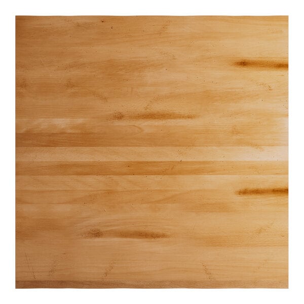 A Lancaster Table & Seating solid wood table top with a honey maple finish.