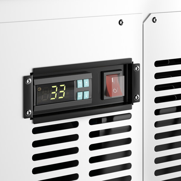 A close-up of the digital display on a white Avantco curved glass deli case.