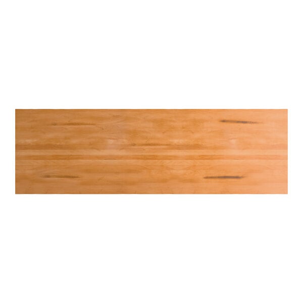 A rectangular solid wood live edge table top with a honey maple finish.