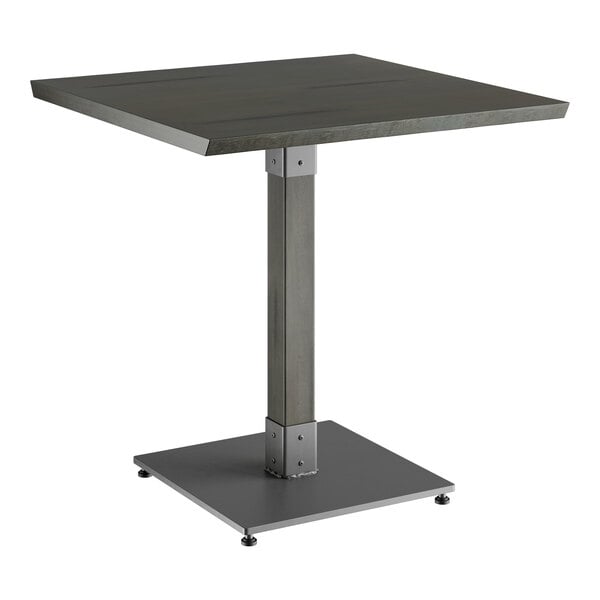 A Lancaster Table & Seating square table with a metal base and a gray top.