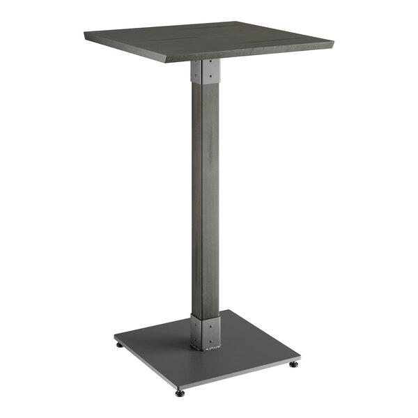 A Lancaster Table & Seating bar height table with a metal base and a gray wood top.