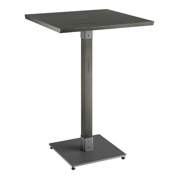 A Lancaster Table & Seating square bar height table with a metal base and a square wood top.