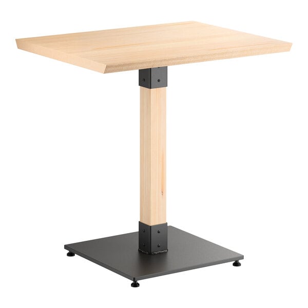 A rectangular table with a light wood top, a matching wood central support, and a black metal square base.