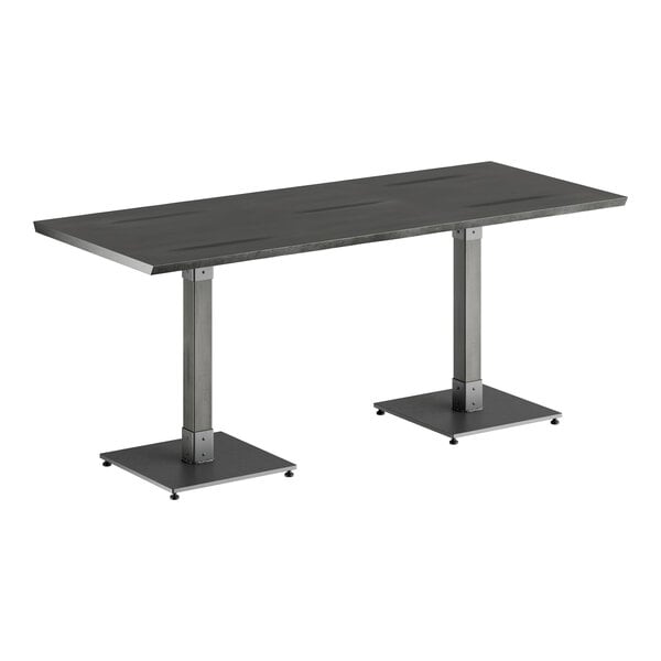 A black rectangular Lancaster Table & Seating live edge table with metal legs.