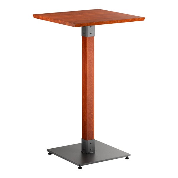 A square bar-height table with a rustic mahogany wood top and a sturdy black metal base.