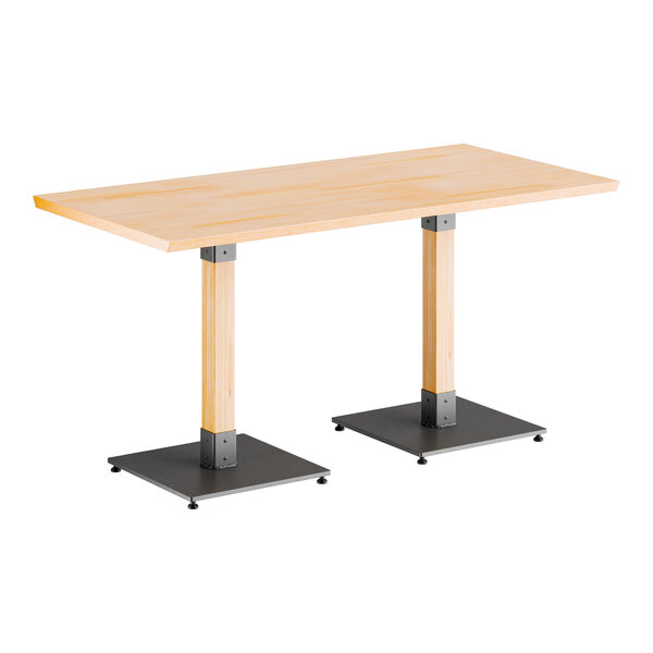 A Lancaster Table & Seating live edge table with metal legs.