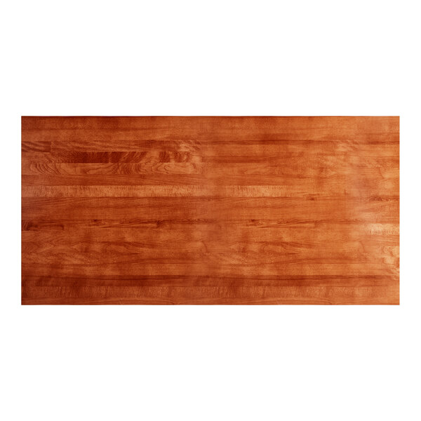 A rectangular solid wood bar height table top with a rustic mahogany finish.