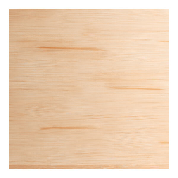 A square solid wood bar height table with a bleached oak finish and a live edge design.