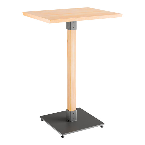 A Lancaster Table & Seating wooden bar table with a metal base.