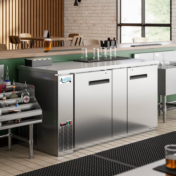 A stainless steel counter with a Avantco Back Bar Refrigerator on it.