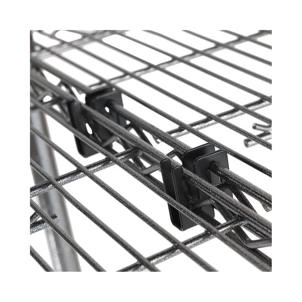 A close-up of a black metal Alera S hook on a metal rack.