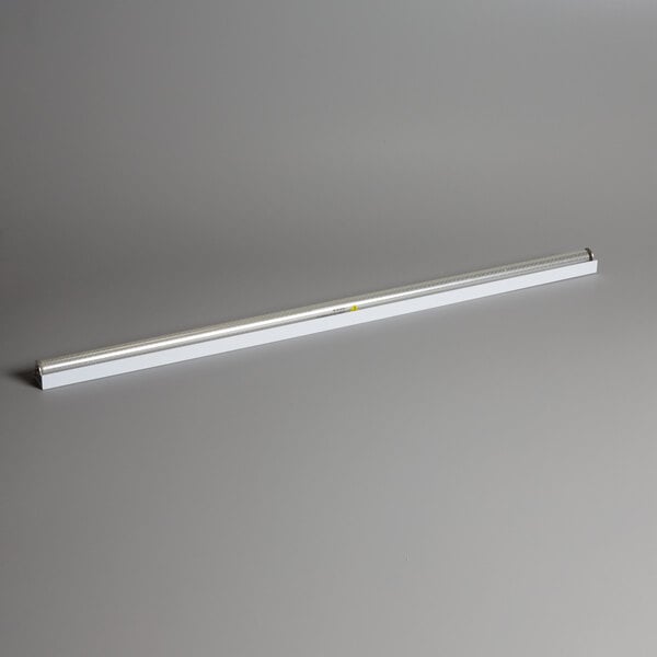 A long white tube with a yellow center.