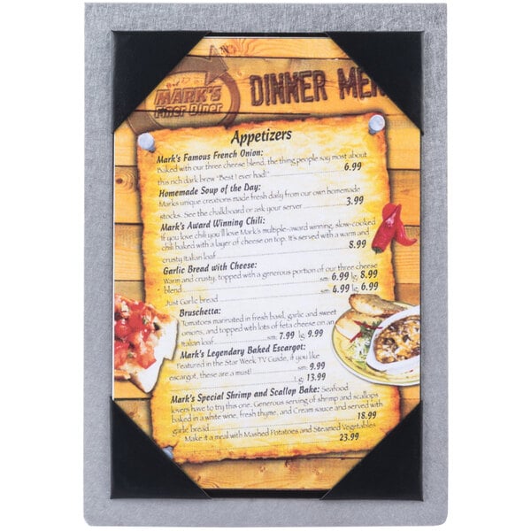 A Menu Solutions Alumitique table tent with a picture of food on it.