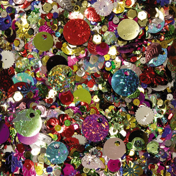 A pile of Creativity Street sequins and spangles in assorted metallic colors.