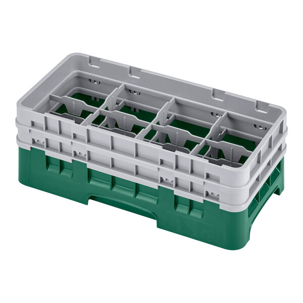 A green plastic Cambro glass rack with 8 compartments and extenders.