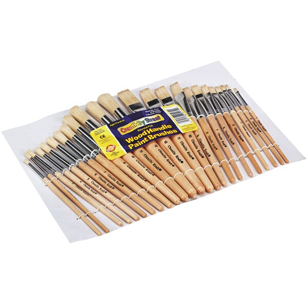 A close-up of several Creativity Street Chenille Kraft preschool paint brushes with round and flat natural bristles and wooden handles.