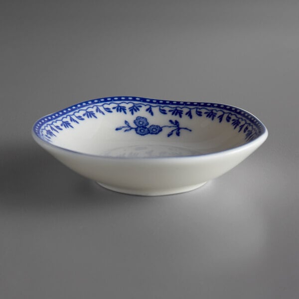 a white bowl with blue designs