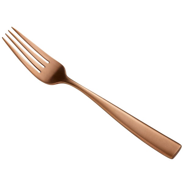 A close-up of a Bon Chef Matte Rose Gold Stainless Steel European Dinner Fork with a copper finish.