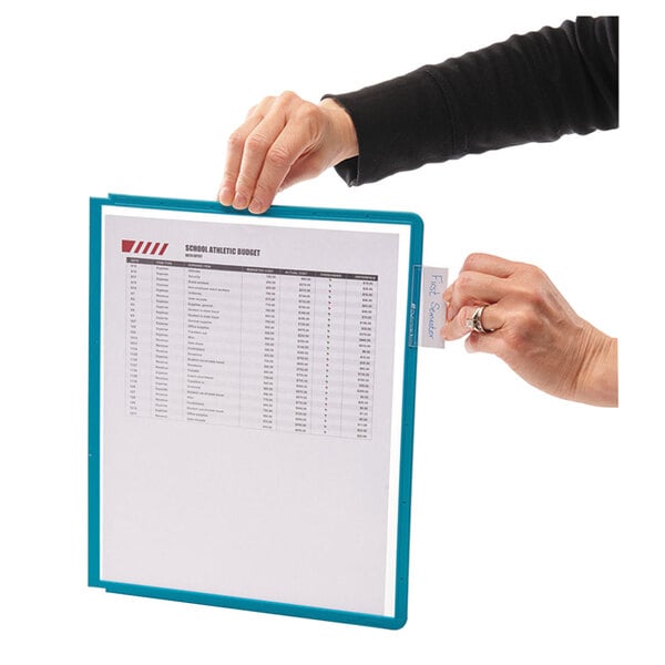 A person using a Durable VARIO desktop reference system to view white papers.