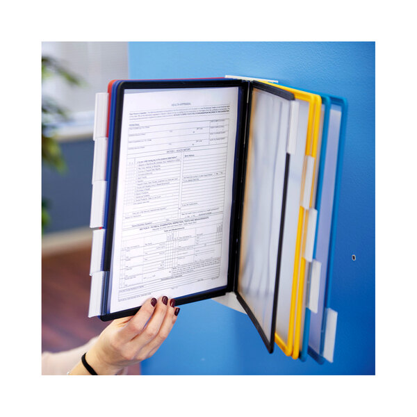 A hand holding a folder with a document.