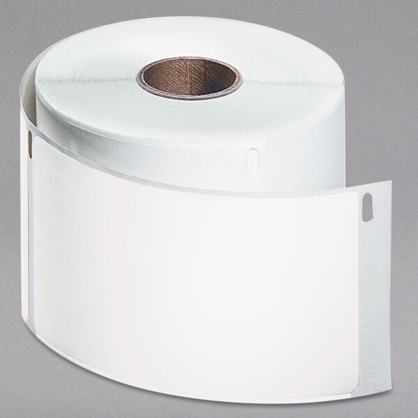 A roll of white paper with DYMO white shipping labels.