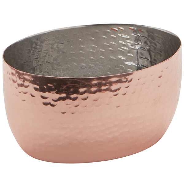 a copper bowl with a textured surface