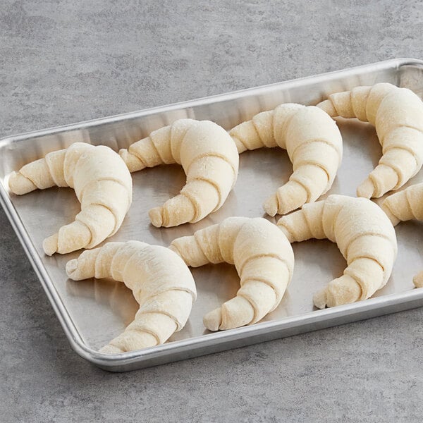 A tray of Pillsbury croissant dough on a counter.