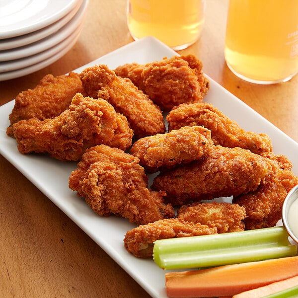 buffalo chicken wings with celery and carrot sticks