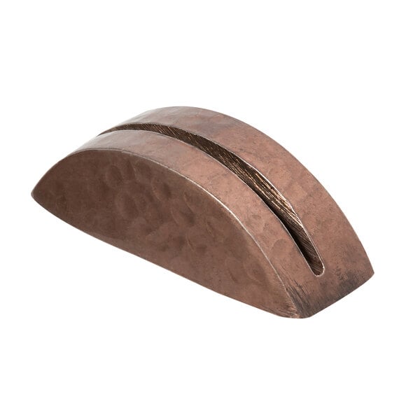 A close-up of an American Metalcraft hammered copper table card holder with a slot.
