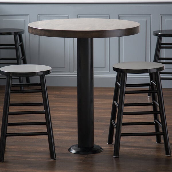 Black steel round bolt down table base with wood table top and two stools