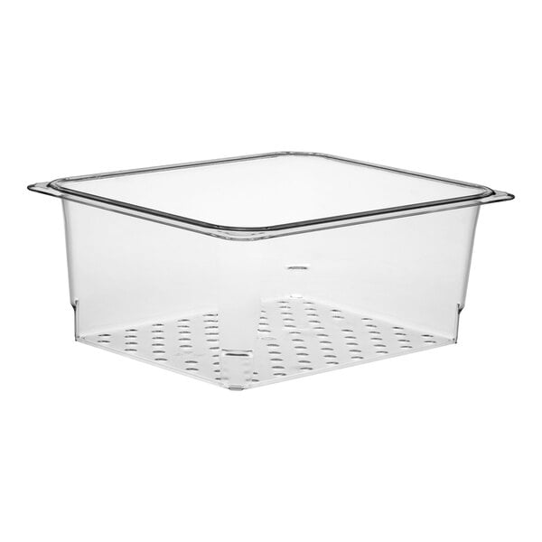 A clear plastic food pan with a colander grid on top.