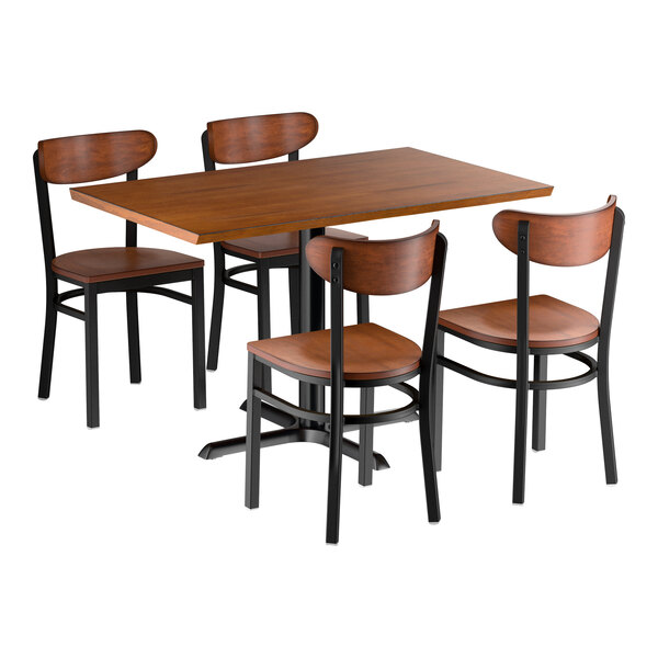 A rectangular wooden dining table with a dark finish, accompanied by four matching chairs with wooden seats and backs and black metal frames.
