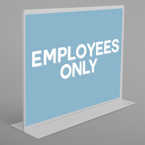 A close-up of a clear double-sided sign holder with white text on it.