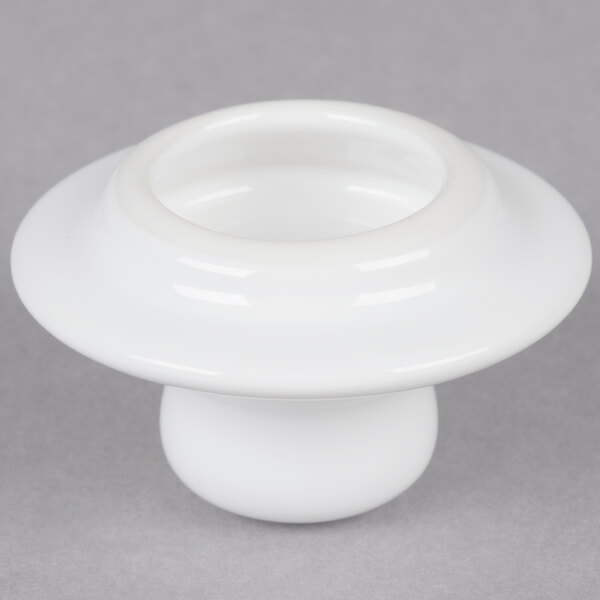 A white Tuxton china teapot lid with a round knob.