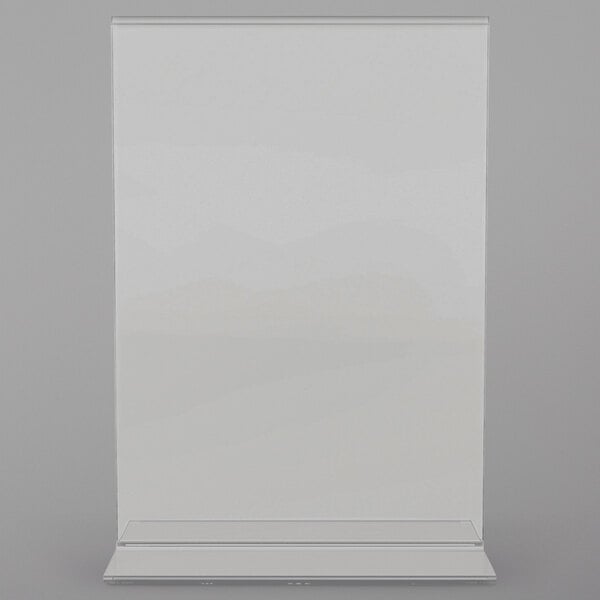 A clear plastic sign holder displaying a white paper with black writing.