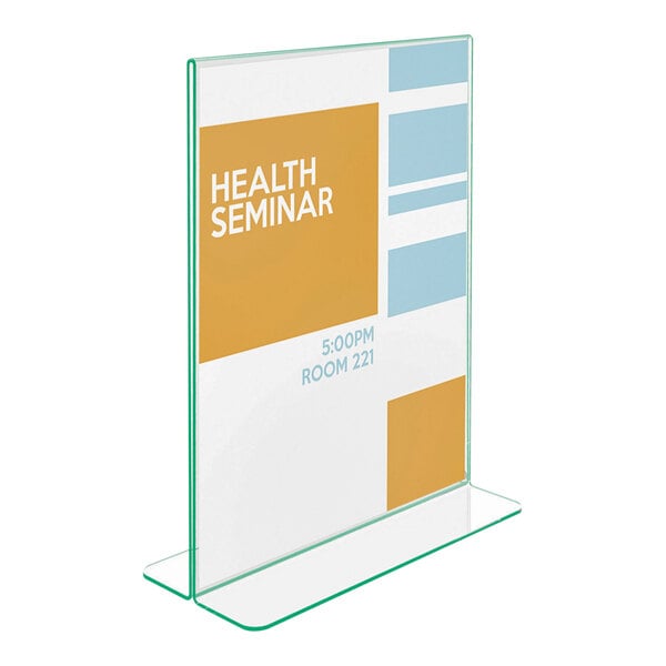 A clear, upright, double-sided sign holder with green-tinted edges displaying a flyer for a health seminar.