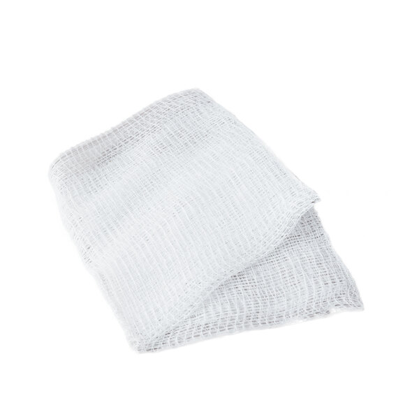 A white Medi-First sterile gauze pad on a white surface.