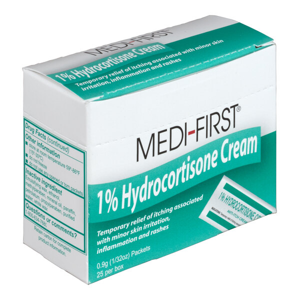 A white box of Medi-First Hydrocortisone Cream packets with green and white text.