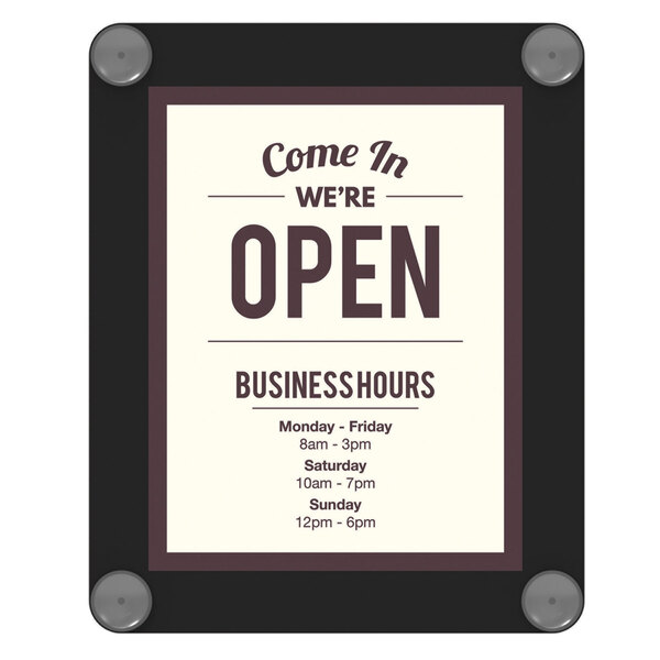 A Deflecto window display sign with black text on a white background and a white border.