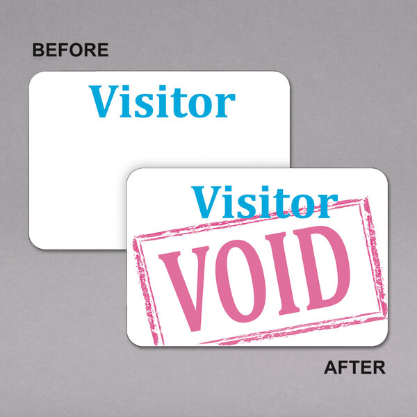 A white visitor badge with blue void stickers.