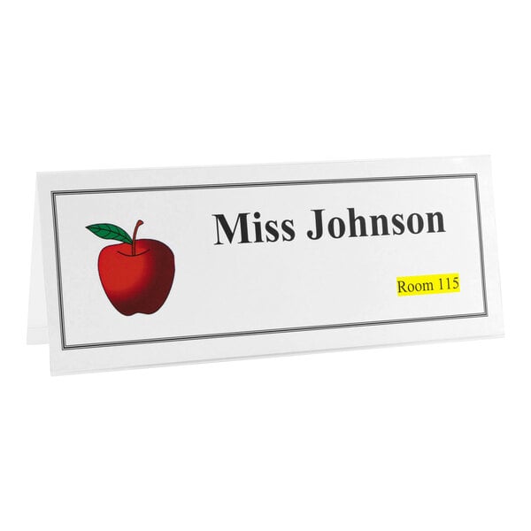 A white tent card with a red apple illustration, the name 'Miss Johnson,' and 'Room 115' highlighted in yellow.