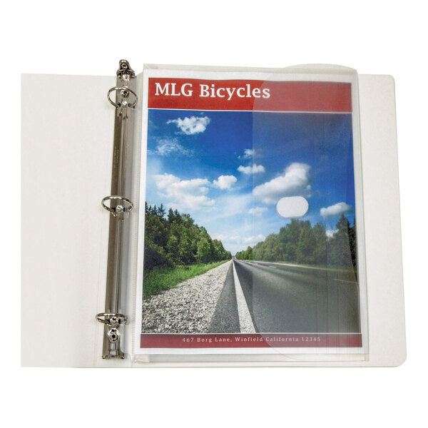 An open three-ring binder containing a clear plastic pocket holding a document with a road and sky image on the cover.