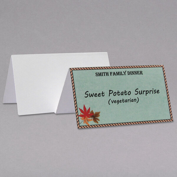 A close-up of a white C-Line scored tent name card with the words "sweet potato surprise" on it.
