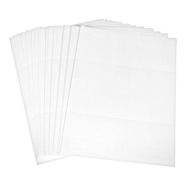 A stack of white rectangular sheets with faint scored lines, likely intended for folding into tent cards.