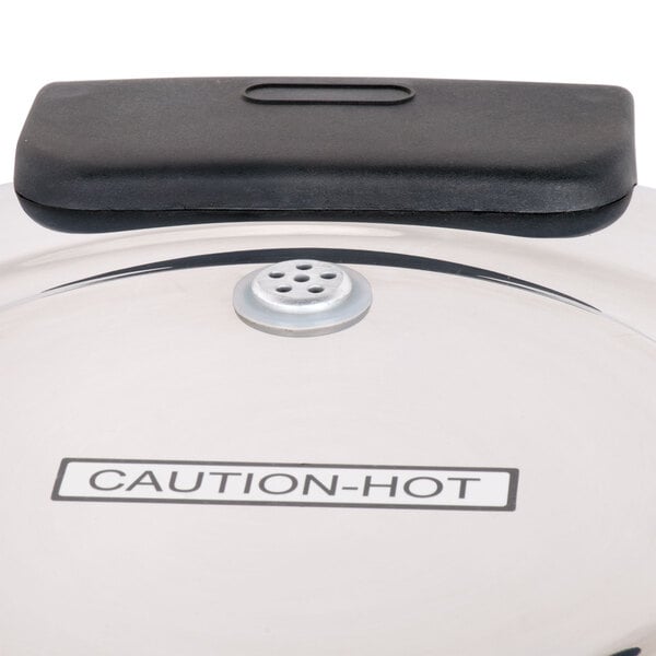 The metal lid of a Town stainless steel rice cooker.